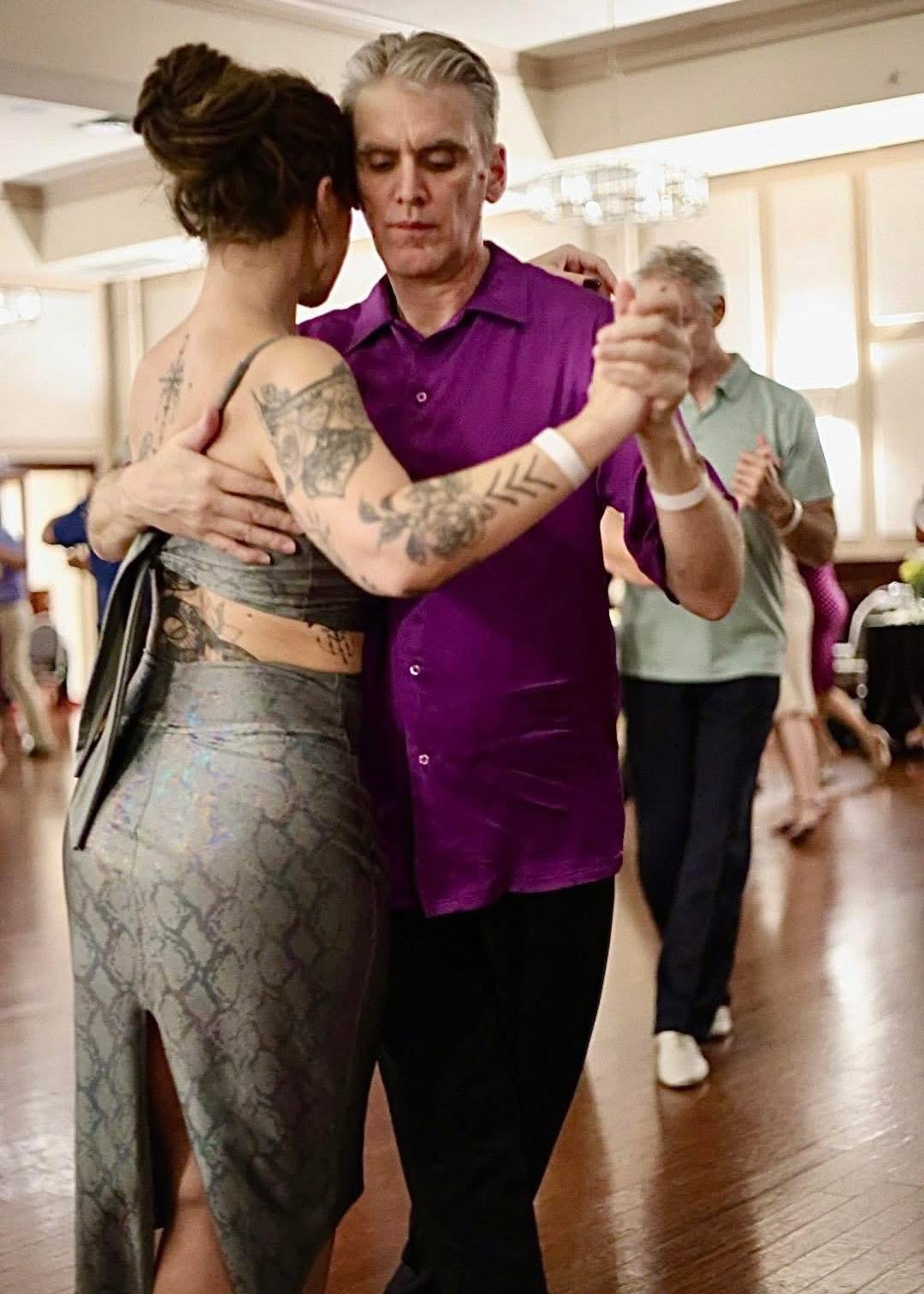 Tango partners sharing a close embrace