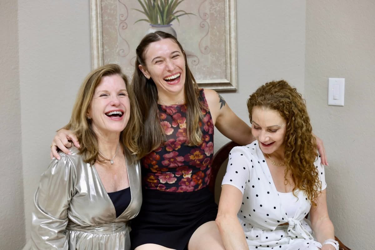 Three friends laughing together at Austin Tango Marathon