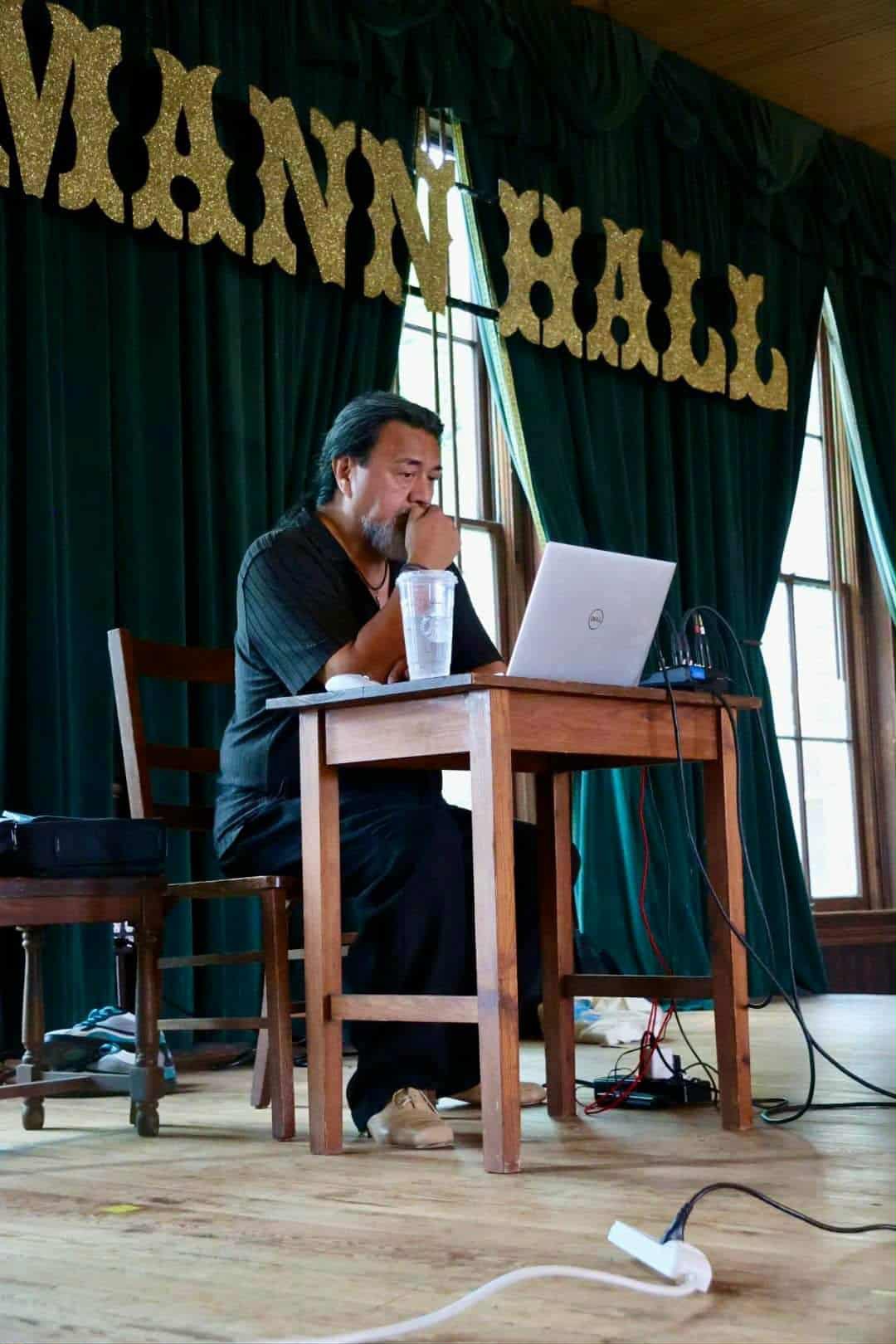 DJ Fil Cruz selecting music at his DJ table